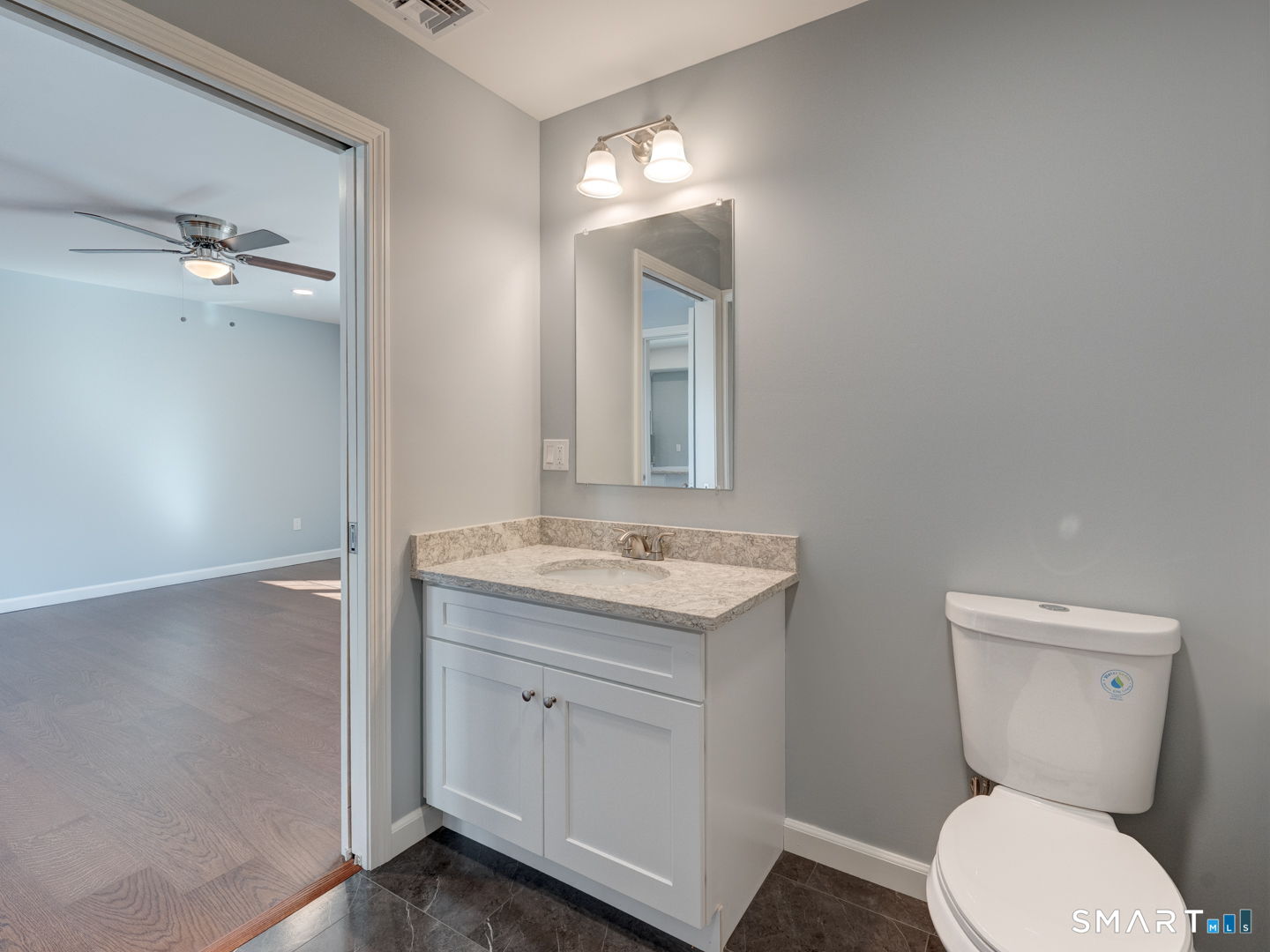 28 Goodell Road Stafford, CT 06076 - Photo 25 of 40 a bathroom with a toilet a sink and mirror