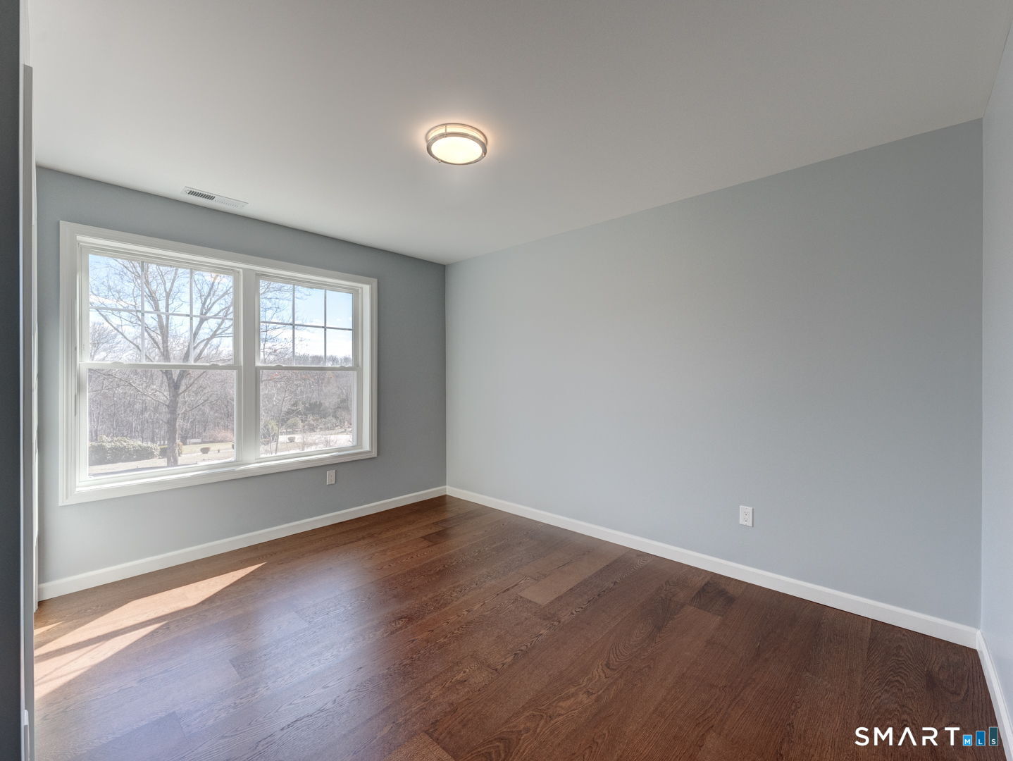 28 Goodell Road Stafford, CT 06076 - Photo 28 of 40 an empty room with wooden floor and windows