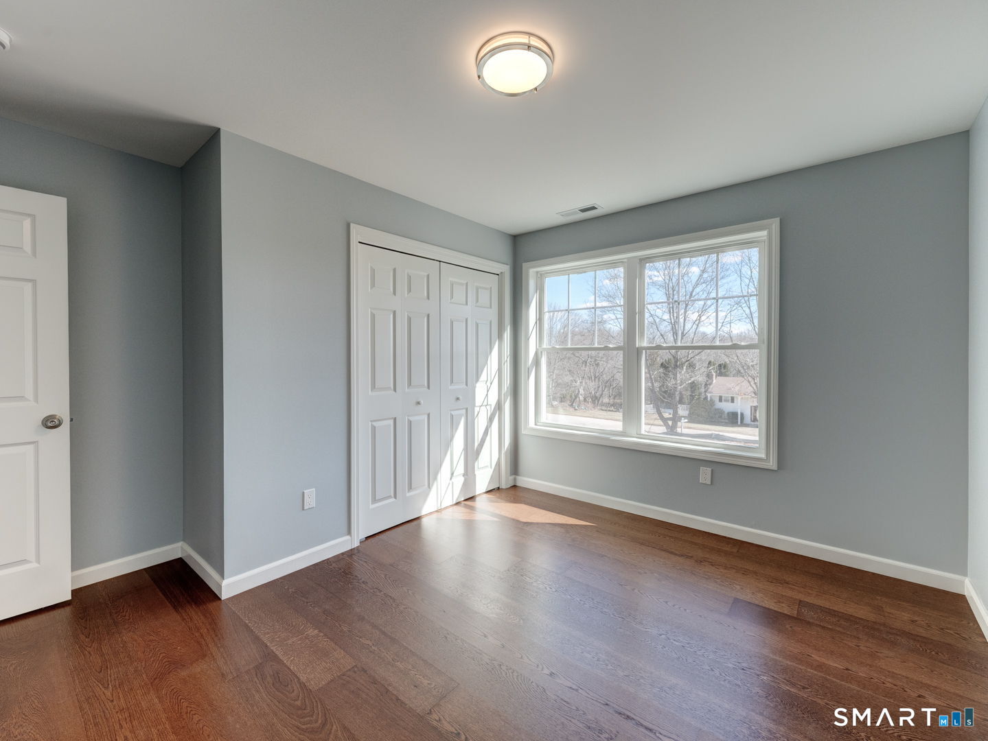 28 Goodell Road Stafford, CT 06076 - Photo 29 of 40 an empty room with wooden floor and windows