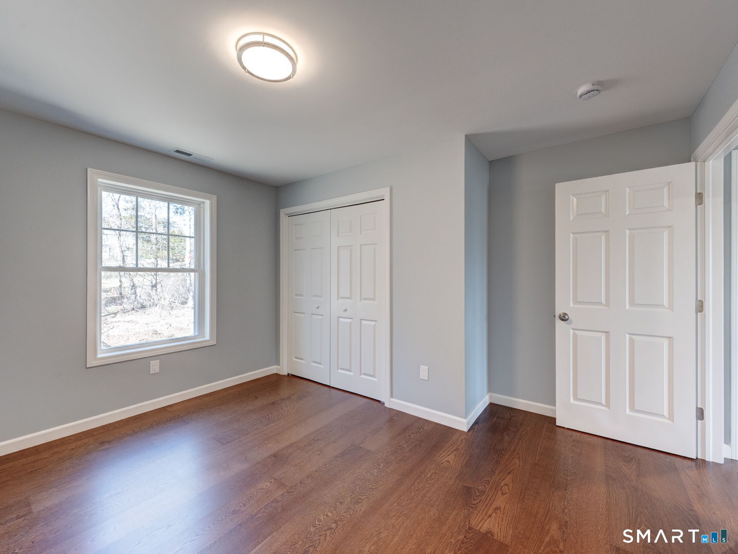 28 Goodell Road Stafford, CT 06076 - Photo 32 of 40 an empty room with wooden floor and windows