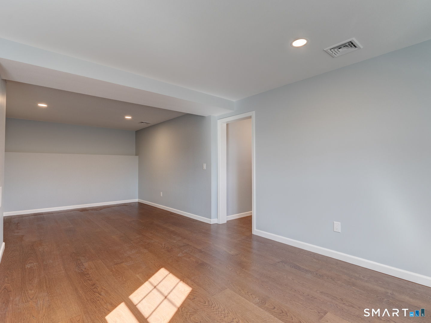 28 Goodell Road Stafford, CT 06076 - Photo 37 of 40 an empty room with wooden floor and windows