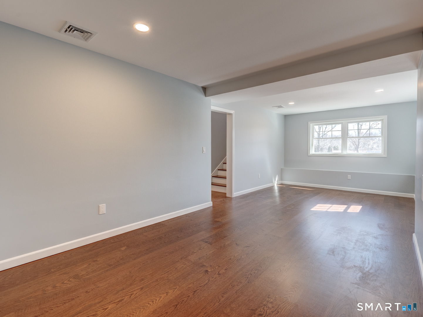 28 Goodell Road Stafford, CT 06076 - Photo 39 of 40 an empty room with wooden floor and windows
