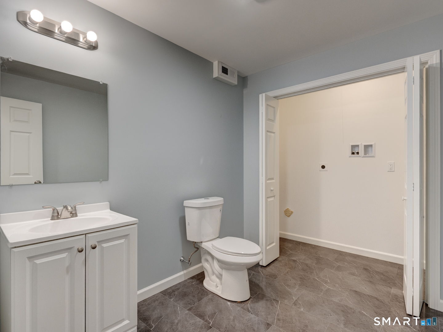 28 Goodell Road Stafford, CT 06076 - Photo 40 of 40 a white toilet sitting next to a bathroom sink