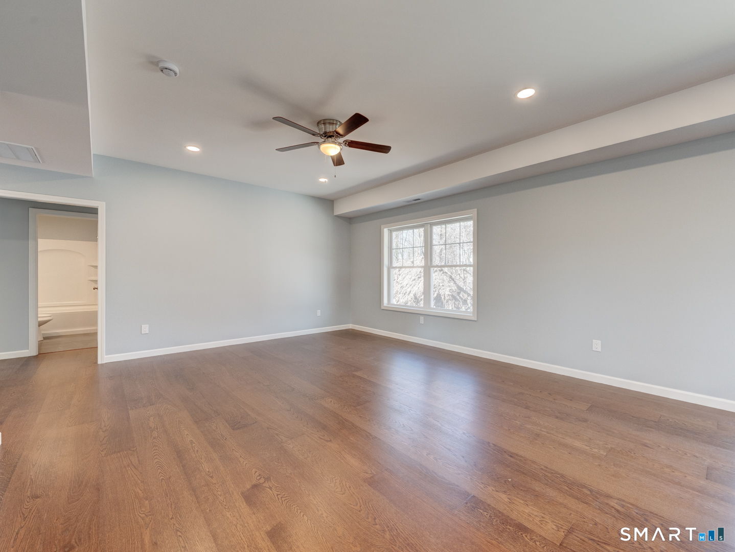 28 Goodell Road Stafford, CT 06076 - Photo 10 of 40 a view of an empty room with a window and wooden floor