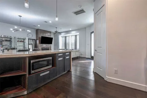 a kitchen with stainless steel appliances a stove a sink and a refrigerator