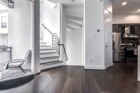 wooden floor in kitchen and a room with wooden floor