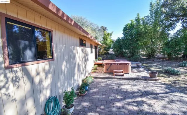 a view of a back yard with a patio