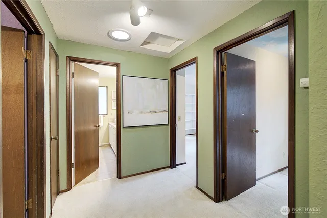 a view of a hallway with closet area