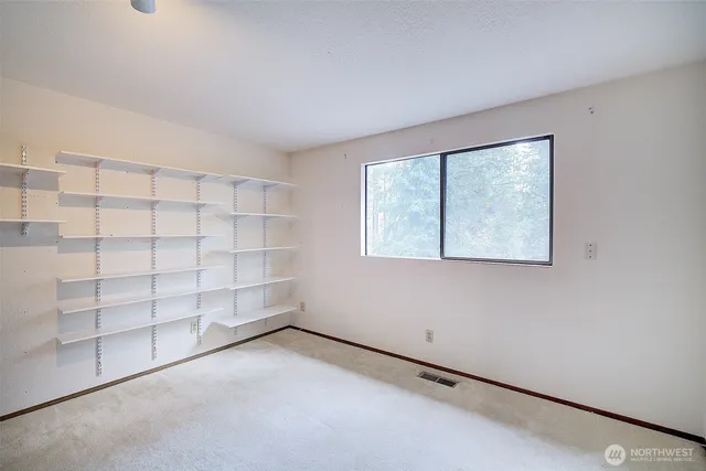 an empty room with shelves