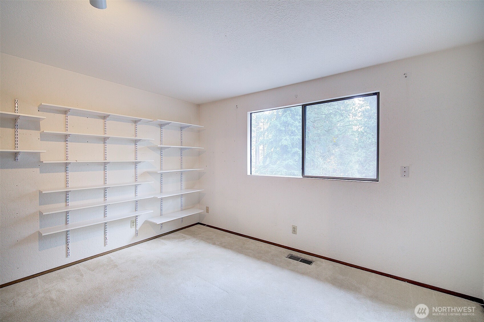 22710 2nd Avenue Southeast Bothell, WA 98021 - Photo 21 of 34 an empty room with shelves