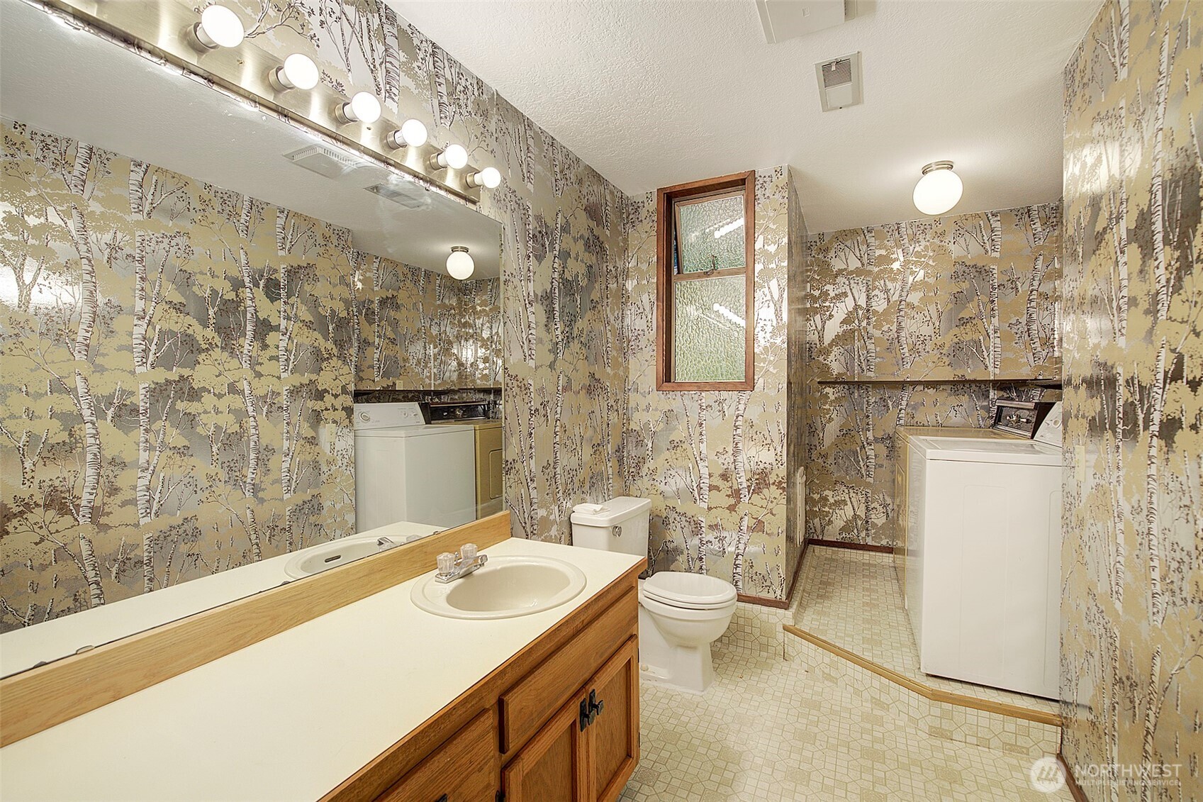 22710 2nd Avenue Southeast Bothell, WA 98021 - Photo 28 of 34 a bathroom with a sink a toilet a mirror and shower