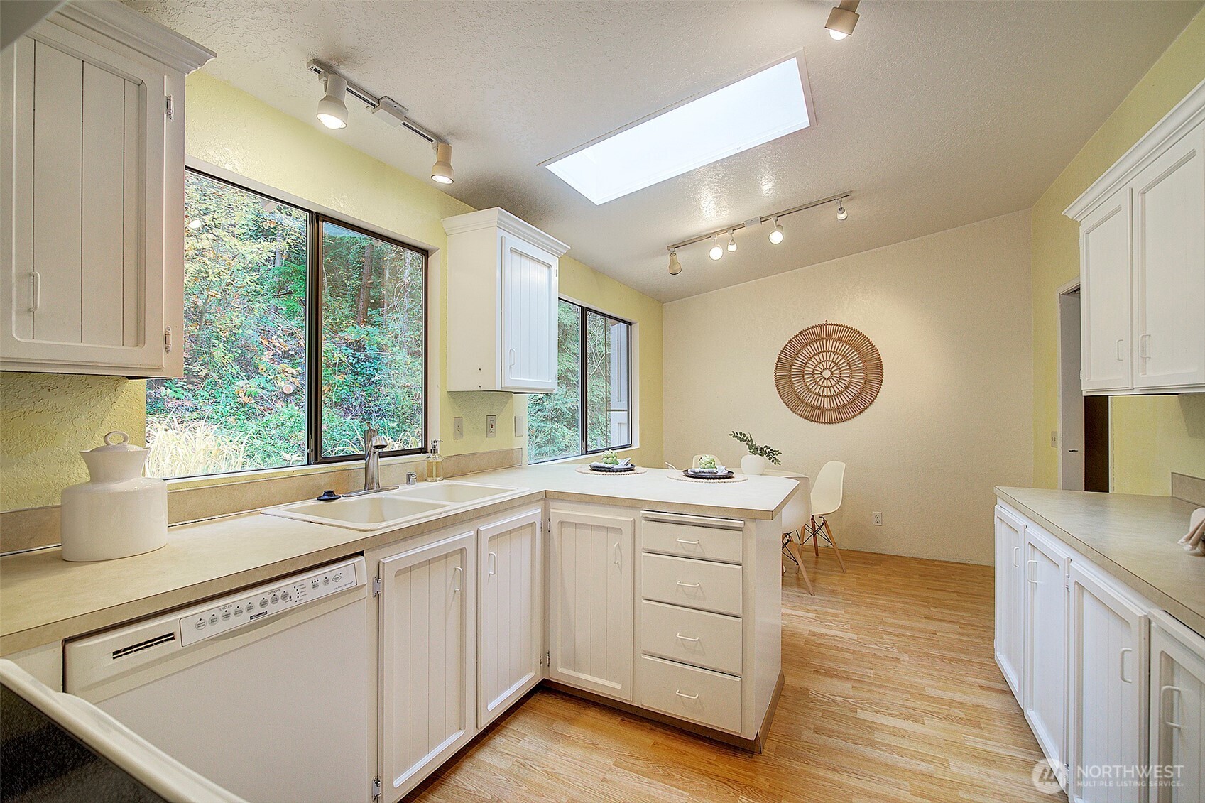 22710 2nd Avenue Southeast Bothell, WA 98021 - Photo 9 of 34 a kitchen with a sink cabinets and window