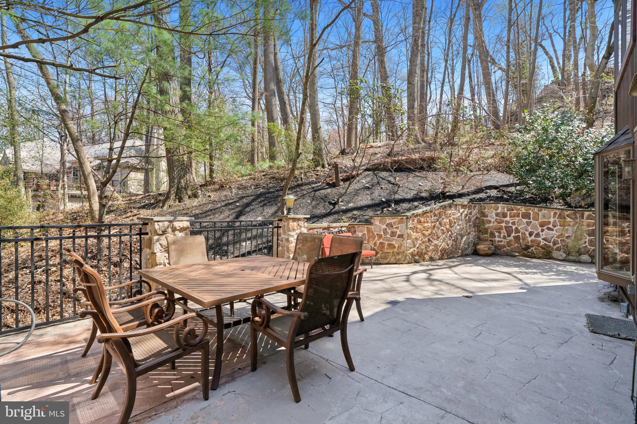 1343 Centennial Road Penn Valley, PA 19072 - Photo 14 of 36 a view of backyard with table and chairs and wooden fence