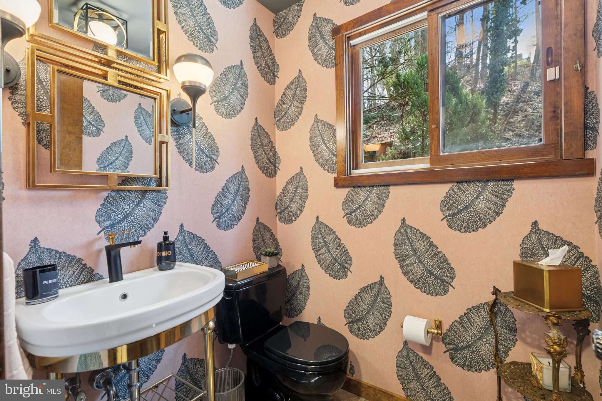 1343 Centennial Road Penn Valley, PA 19072 - Photo 17 of 36 a bathroom with a toilet sink and mirror