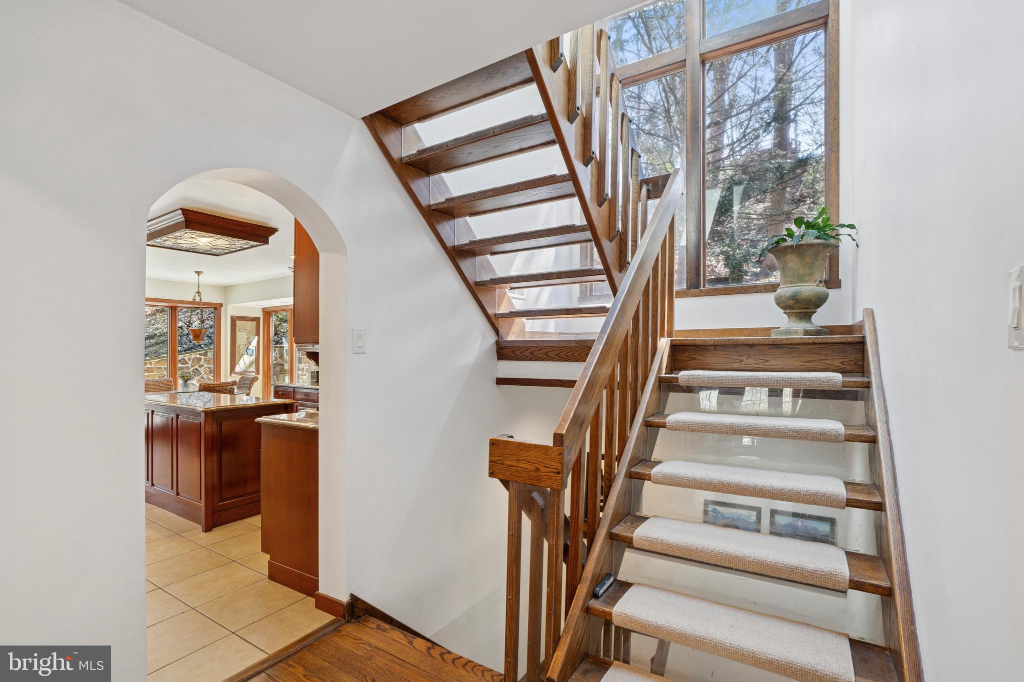 1343 Centennial Road Penn Valley, PA 19072 - Photo 22 of 36 a view of staircase with white walls and a window