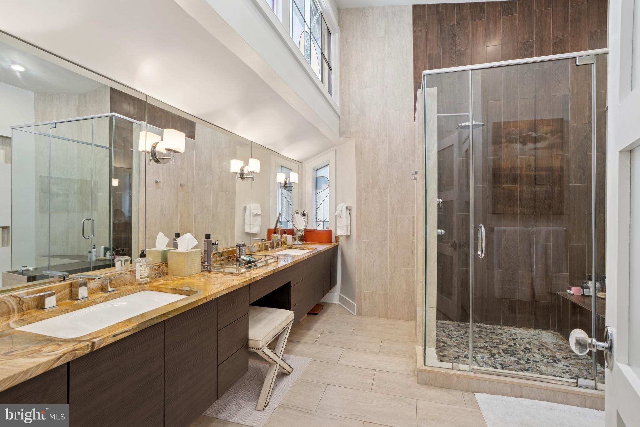 1343 Centennial Road Penn Valley, PA 19072 - Photo 26 of 36 a bathroom with a double vanity sink mirror and shower