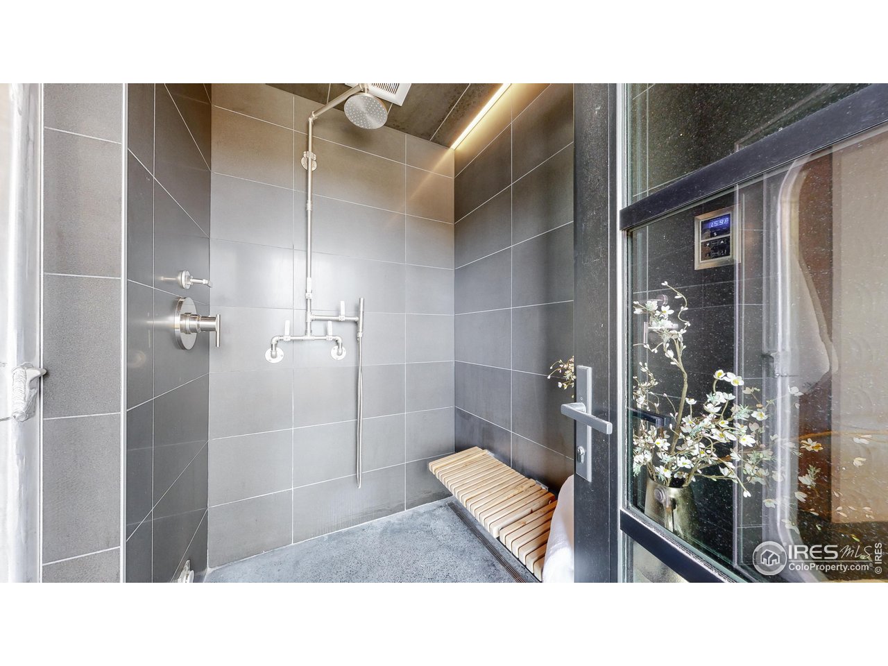 987 Lost Angel Road Boulder, CO 80302 - Photo 16 of 40 a bathroom with a sink and mirror