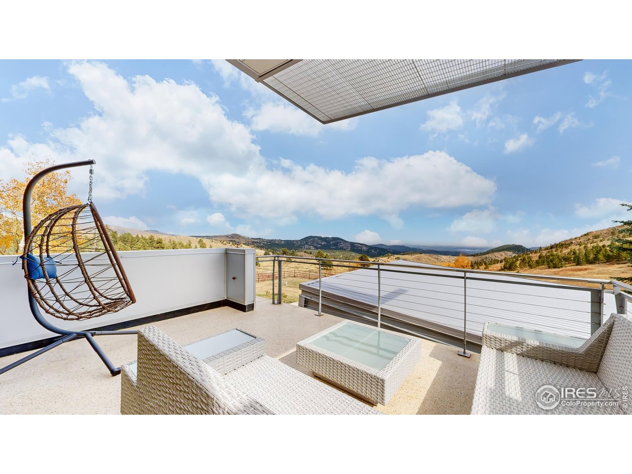 987 Lost Angel Road Boulder, CO 80302 - Photo 26 of 40 a view of a terrace with couches and wooden floor