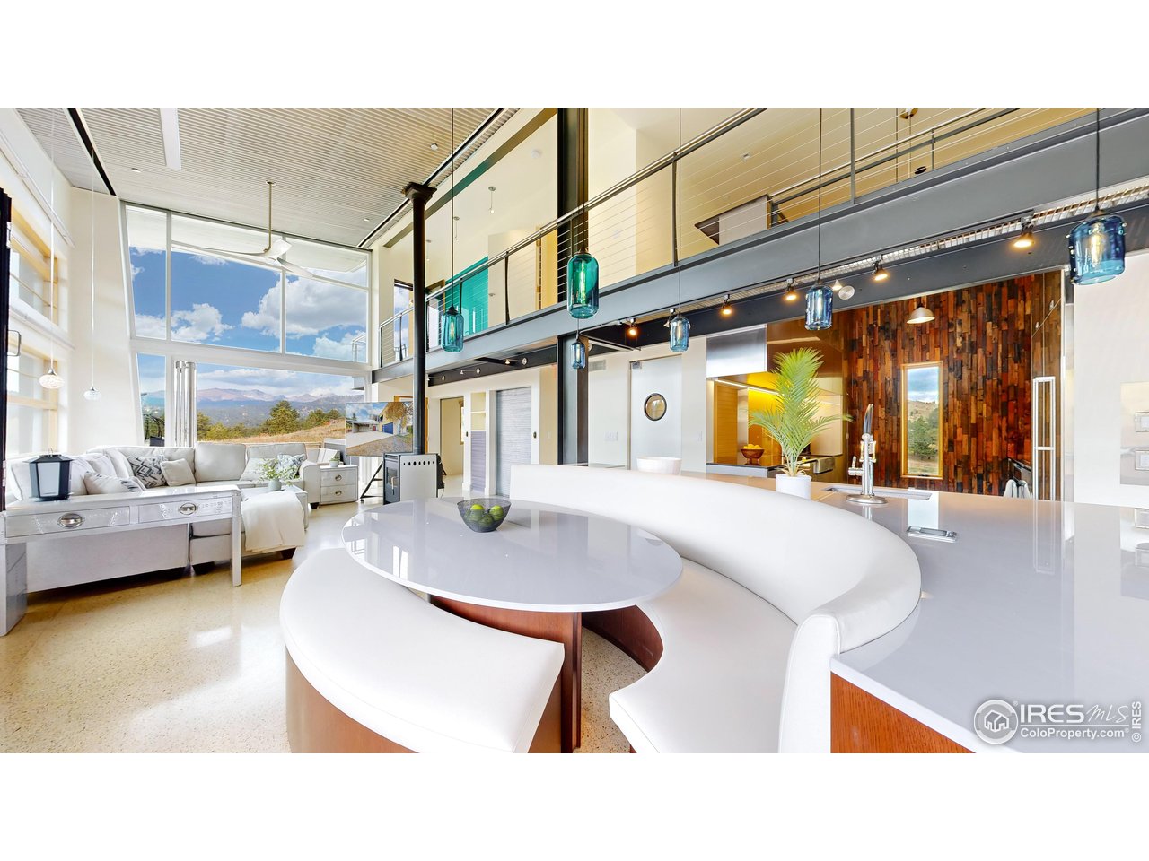 987 Lost Angel Road Boulder, CO 80302 - Photo 3 of 40 a balcony with table and chairs