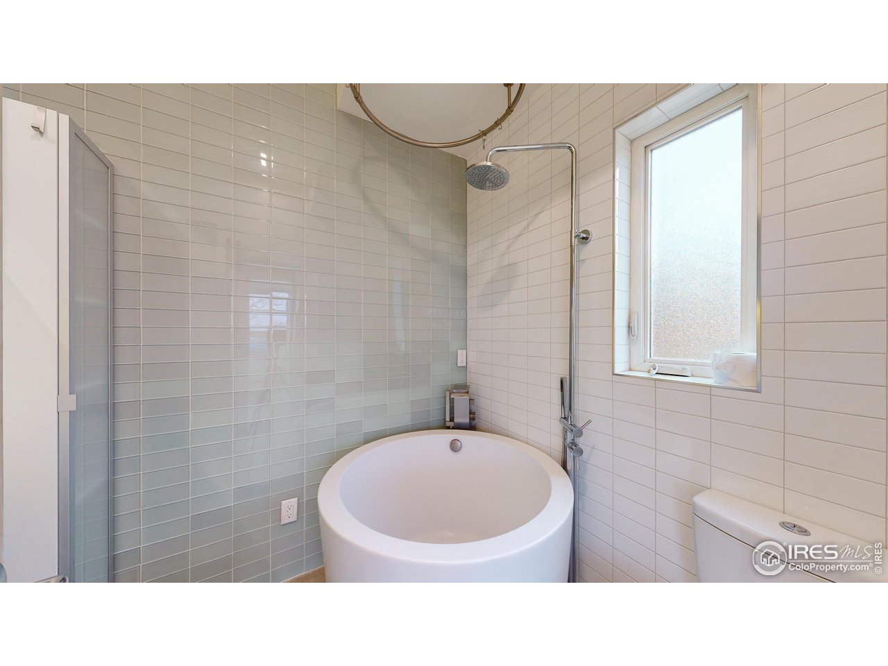 987 Lost Angel Road Boulder, CO 80302 - Photo 36 of 40 a bathroom with a sink and a mirror