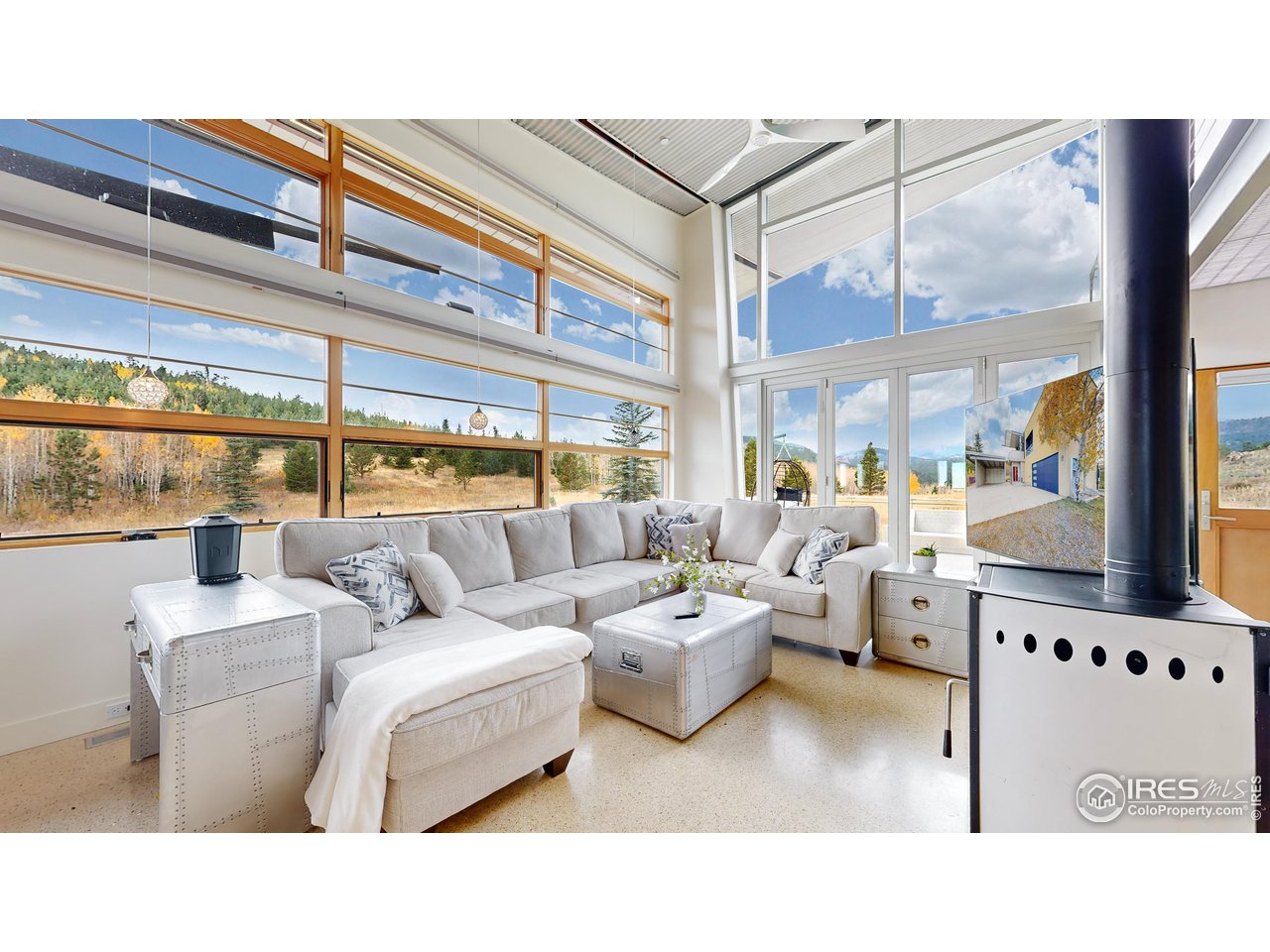 987 Lost Angel Road Boulder, CO 80302 - Photo 5 of 40 a living room with furniture and a large window