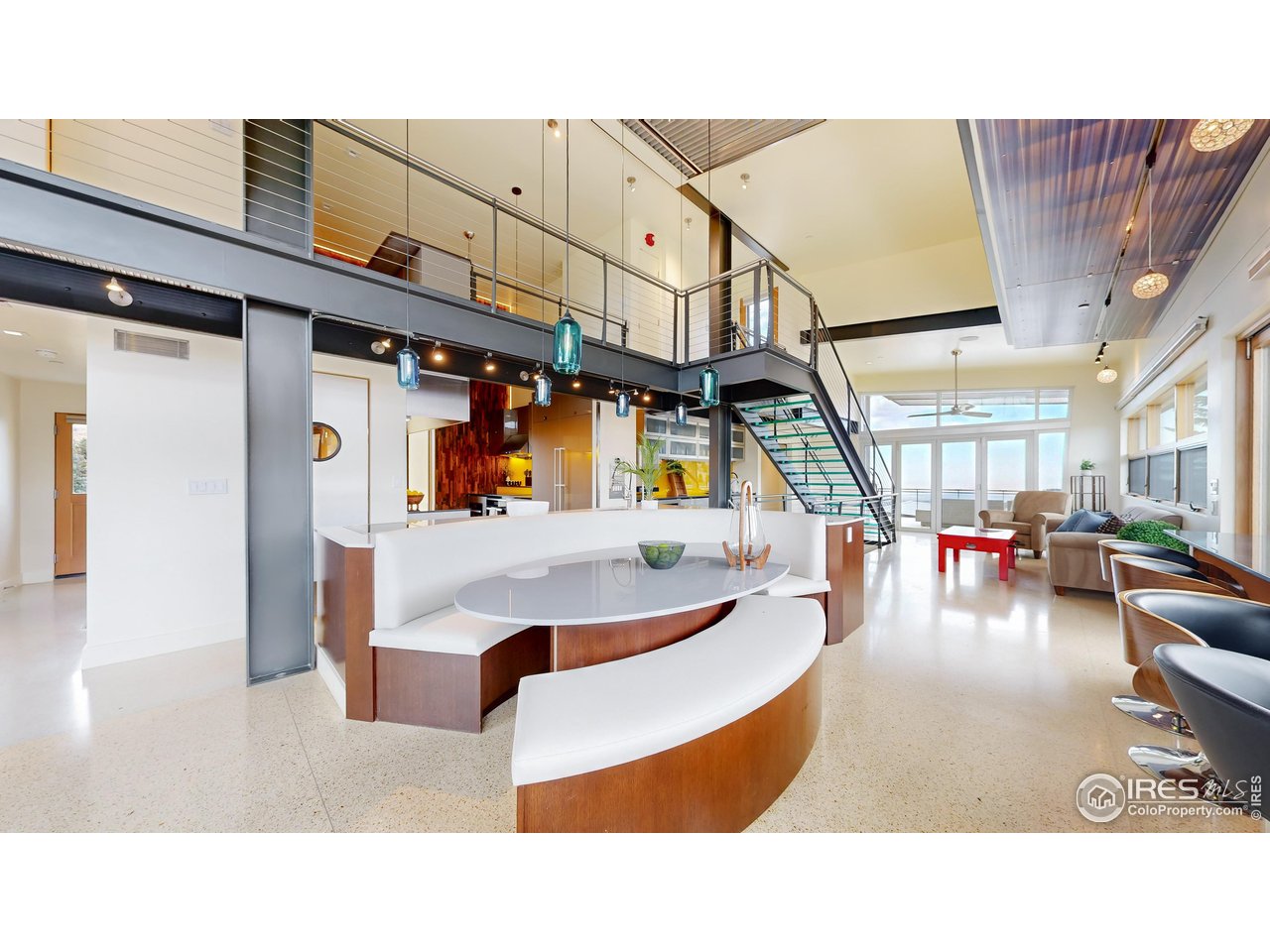 987 Lost Angel Road Boulder, CO 80302 - Photo 8 of 40 a living room with furniture and a chandelier
