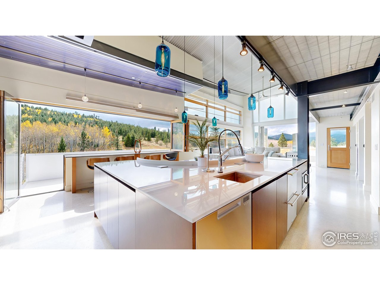 987 Lost Angel Road Boulder, CO 80302 - Photo 9 of 40 a kitchen with stainless steel appliances kitchen island granite countertop a sink and cabinets