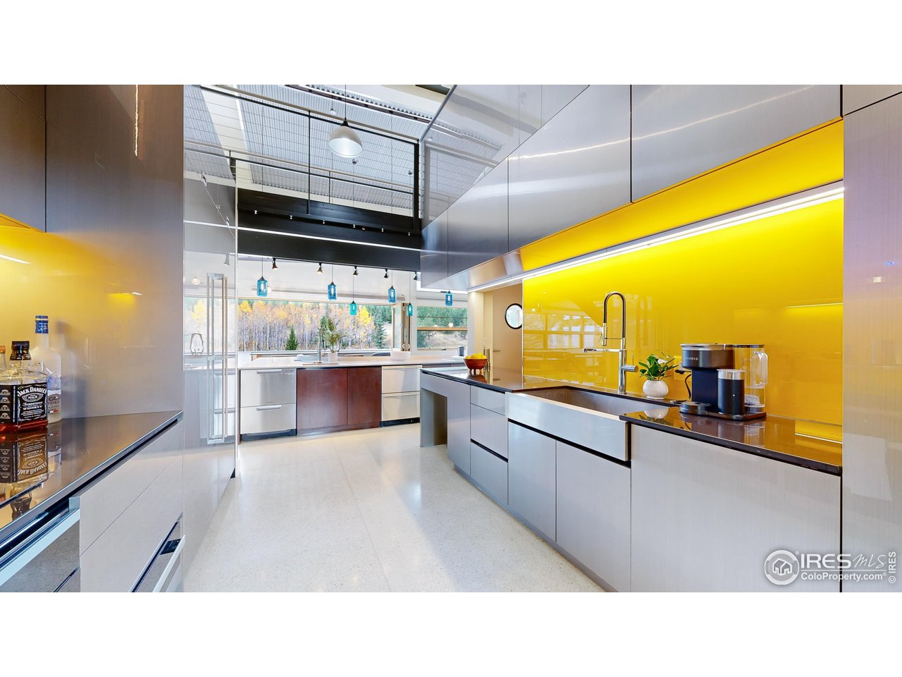 987 Lost Angel Road Boulder, CO 80302 - Photo 10 of 40 a kitchen with stainless steel appliances kitchen island granite countertop a sink and cabinets