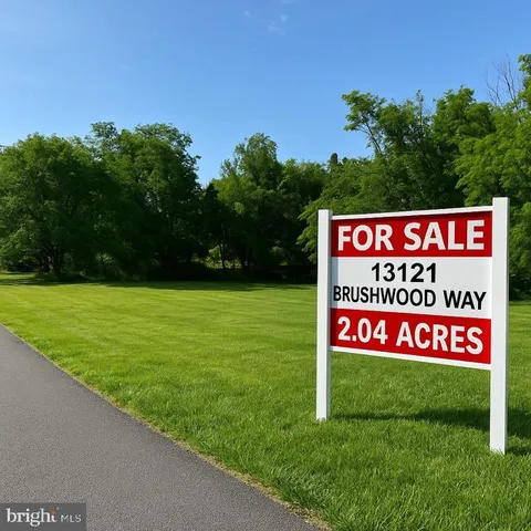 a sign that is sitting on a lush green field