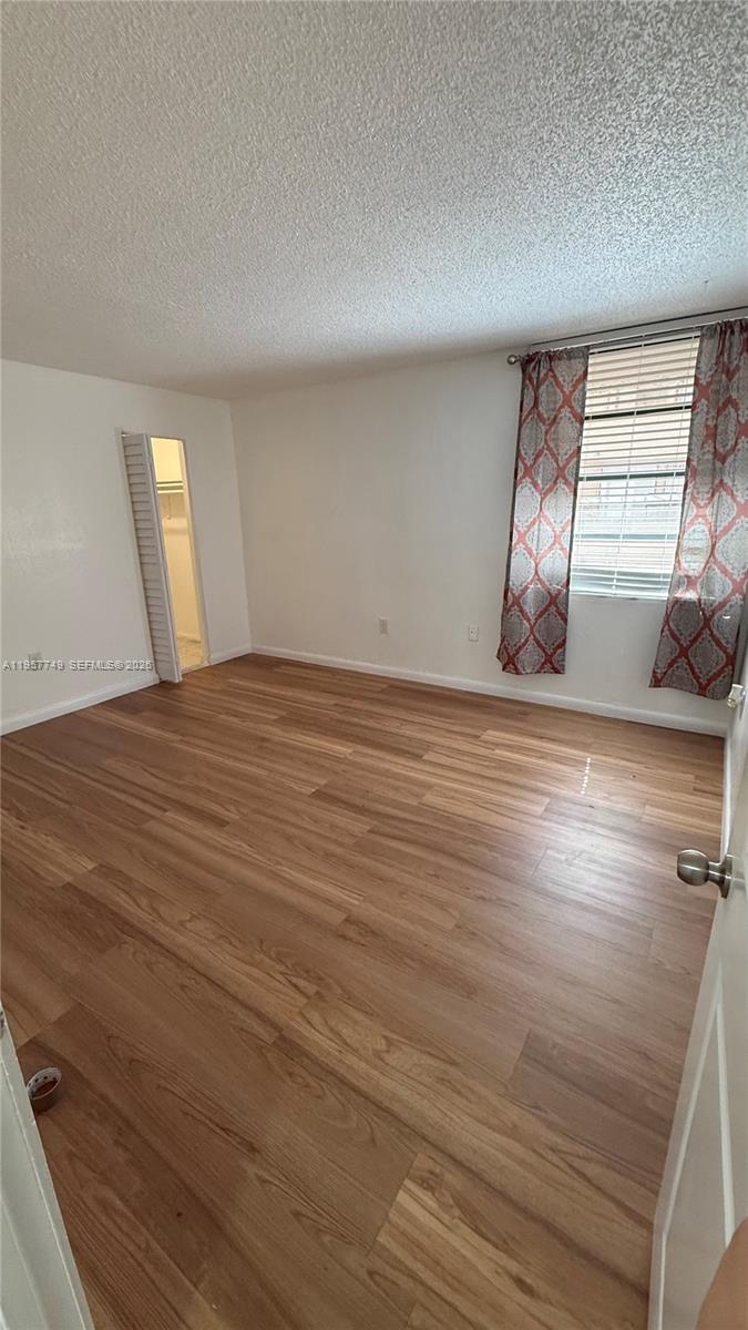 10400 Southwest 108th Avenue, Unit A202 Miami, FL 33176 - Photo 9 of 23 a view of an empty room and window