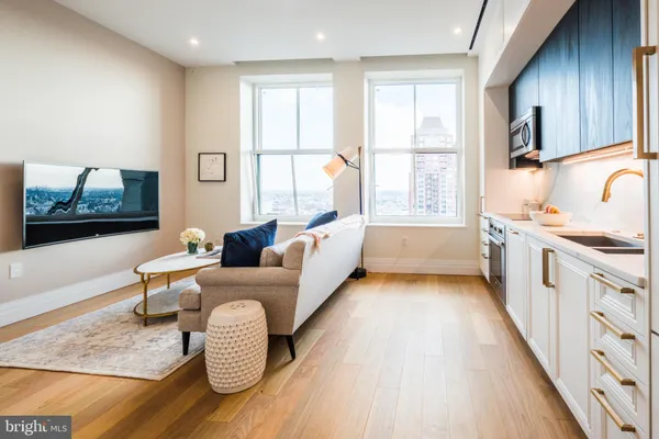 a living room with furniture and a large window