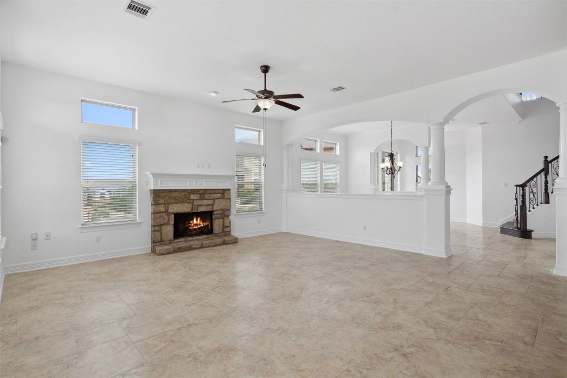 111 ANTONIO Way, Unit 5A Austin, TX 78734 - Photo 12 of 40 an empty room with windows and fireplace