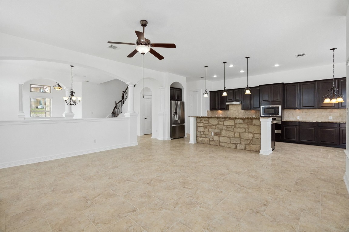 111 ANTONIO Way, Unit 5A Austin, TX 78734 - Photo 13 of 40 a view of a kitchen with a sink and a window