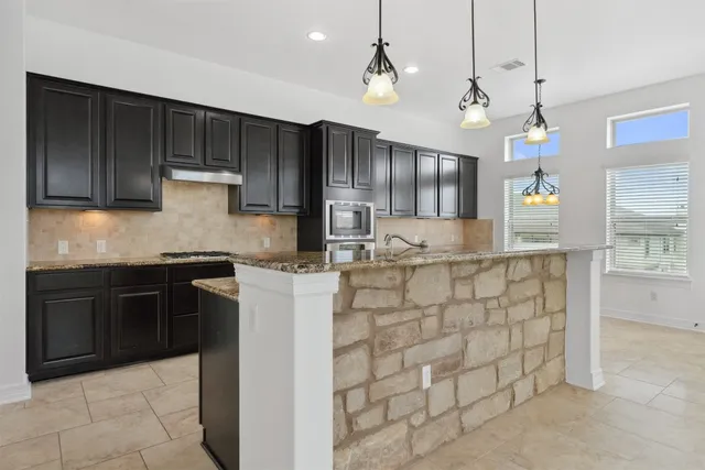 a kitchen with sink cabinets and outdoor counter space