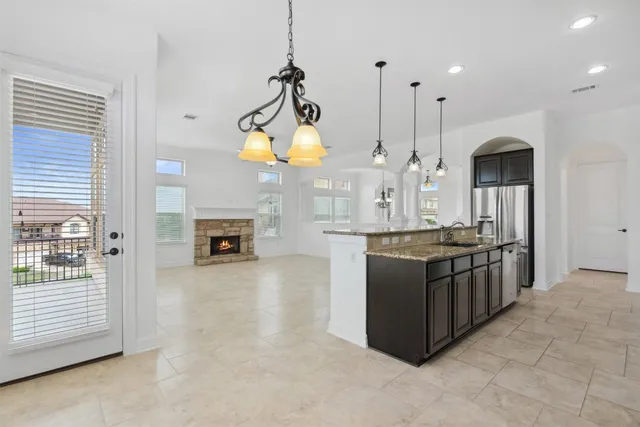 a view of a white house with a small yard