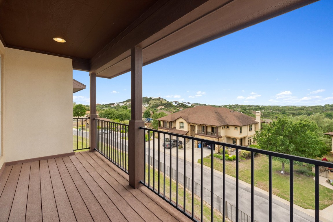 111 ANTONIO Way, Unit 5A Austin, TX 78734 - Photo 24 of 40 a view of a balcony with wooden floor