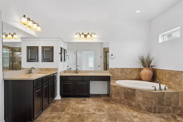 a living room with furniture and a glass door shower