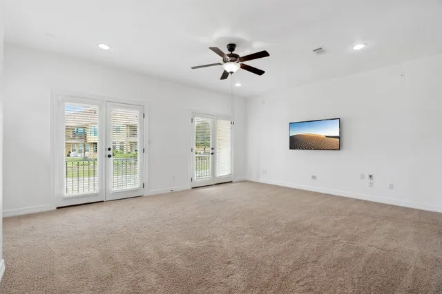 a view of a livingroom with a ceiling fan