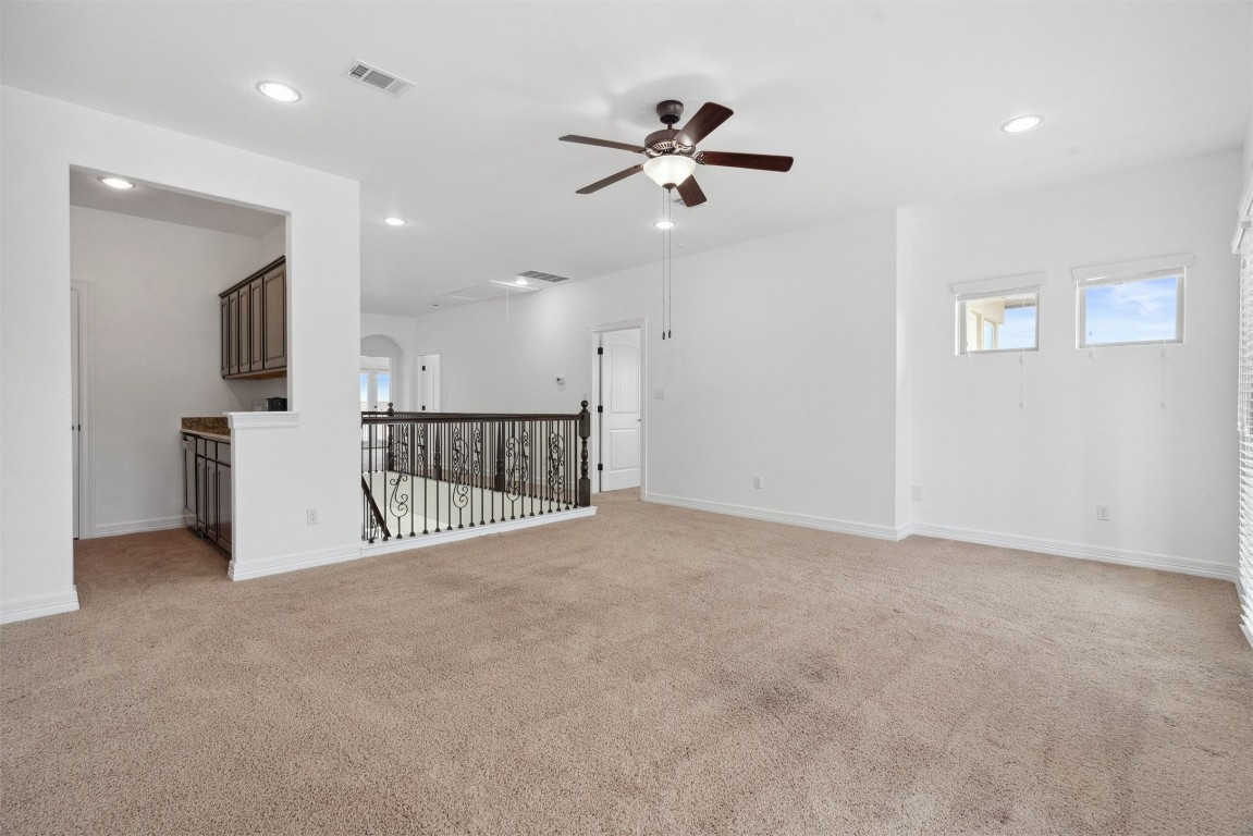 111 ANTONIO Way, Unit 5A Austin, TX 78734 - Photo 29 of 40 a view of a livingroom with a ceiling fan