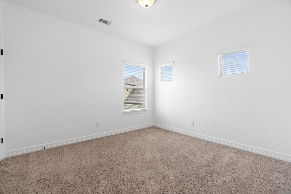 111 ANTONIO Way, Unit 5A Austin, TX 78734 - Photo 31 of 40 an empty room with windows