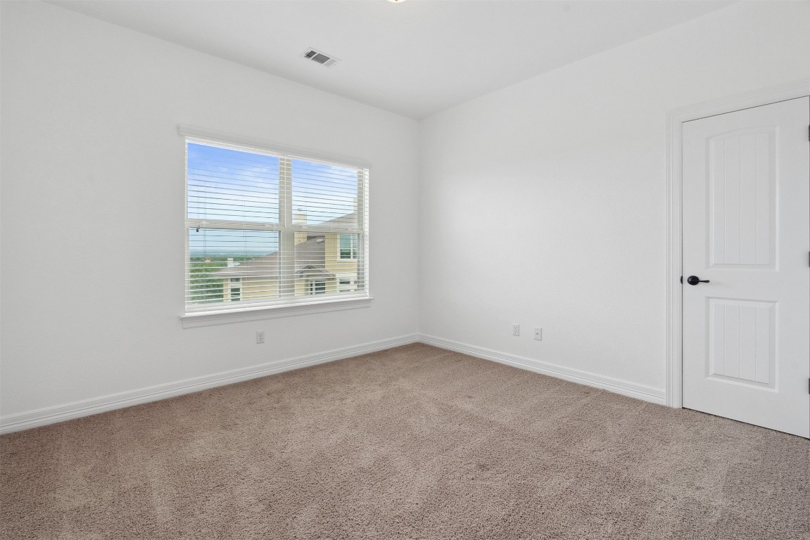 111 ANTONIO Way, Unit 5A Austin, TX 78734 - Photo 33 of 40 an empty room with windows