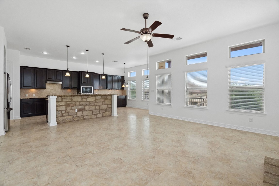 111 ANTONIO Way, Unit 5A Austin, TX 78734 - Photo 6 of 40 a view of a kitchen with a sink and a window