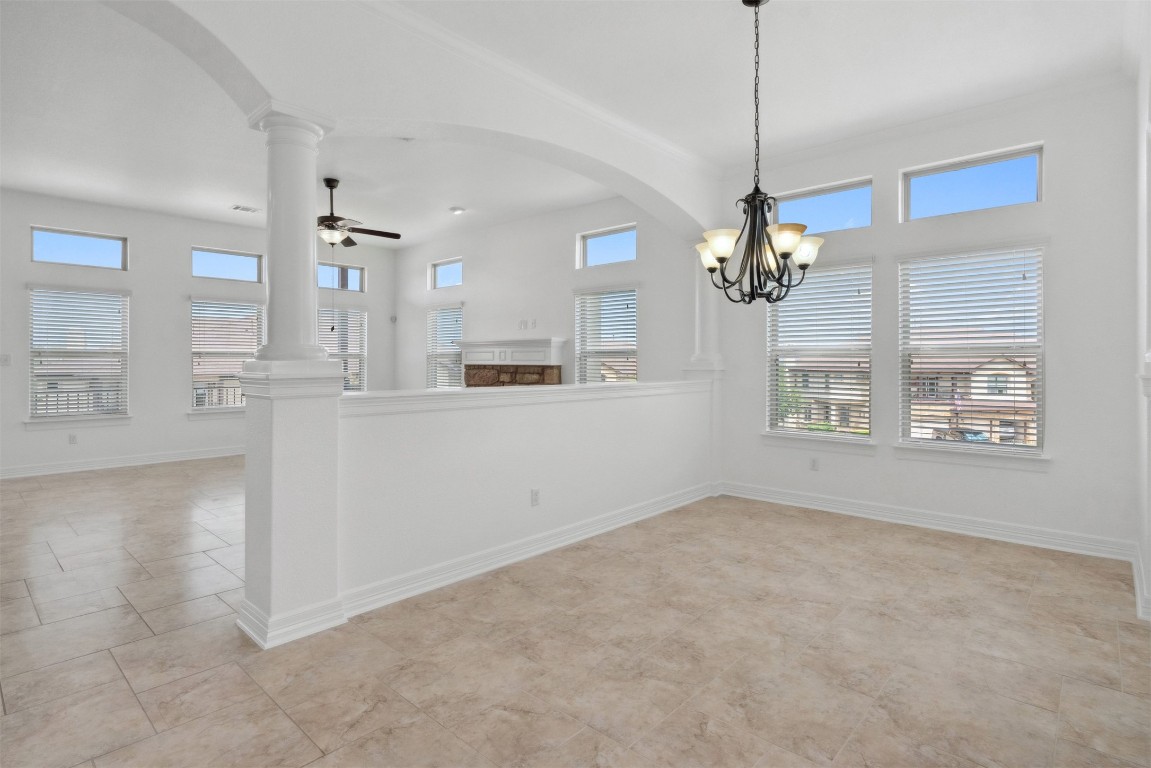 111 ANTONIO Way, Unit 5A Austin, TX 78734 - Photo 9 of 40 a view of a kitchen with a sink and chandelier