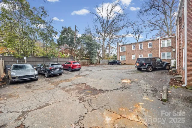 a view of a brick building with many windows