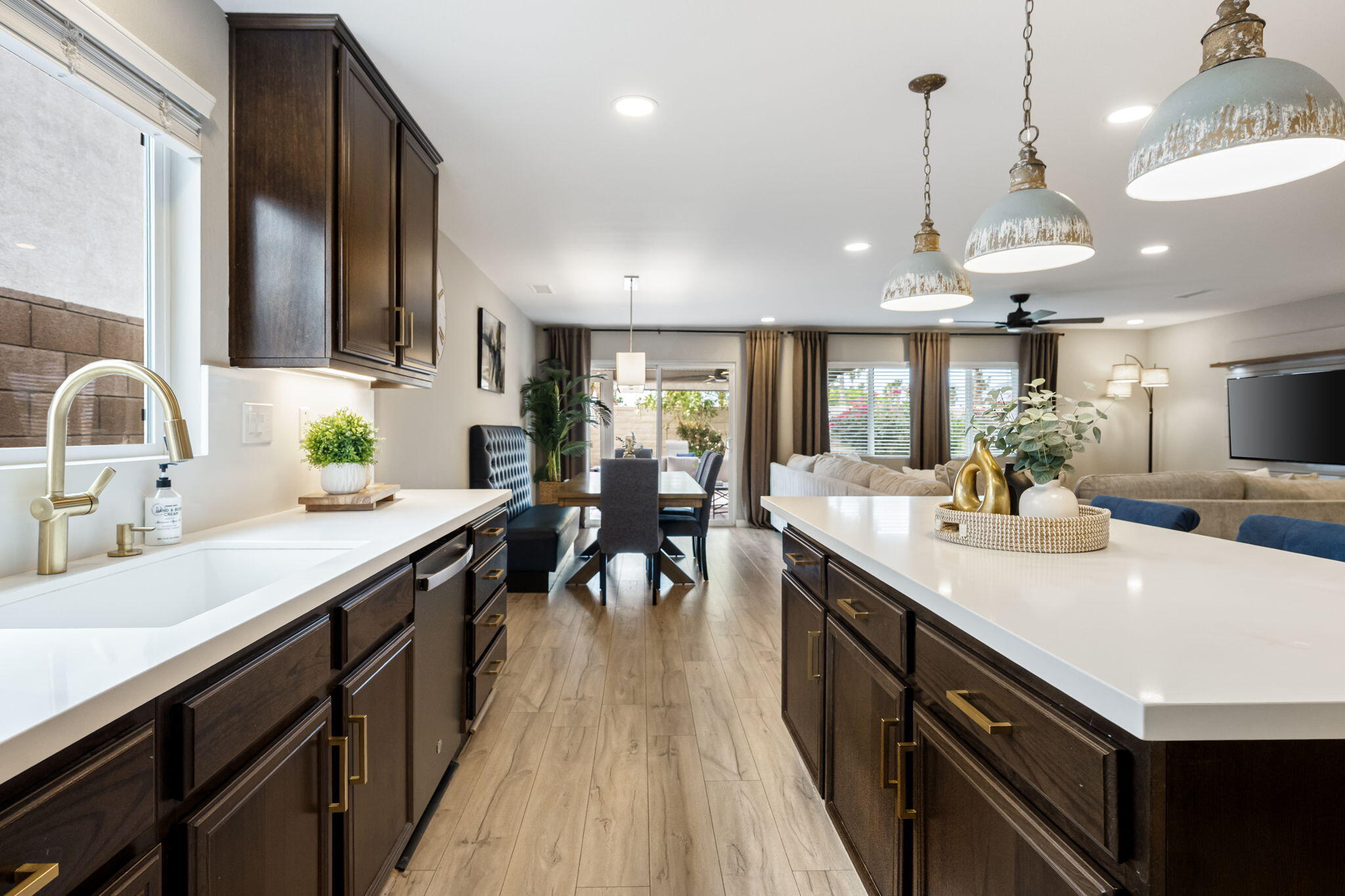 84131 Azzura Way Indio, CA 92203 - Photo 11 of 38 a kitchen with lots of counter space a sink appliances and living room view