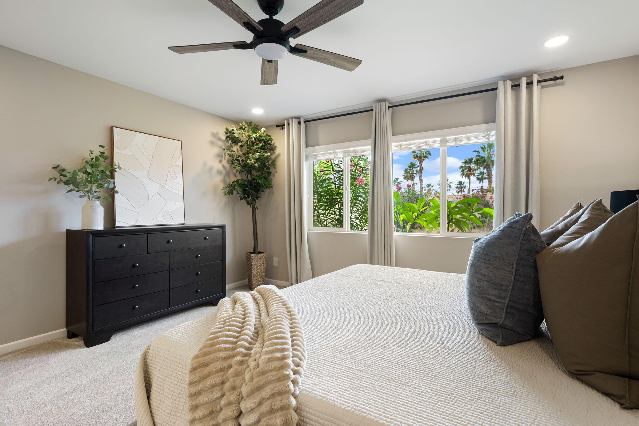 84131 Azzura Way Indio, CA 92203 - Photo 14 of 38 a bedroom with a large bed and a window