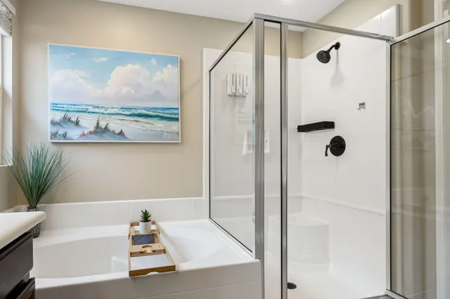 a bathroom with a tub and shower