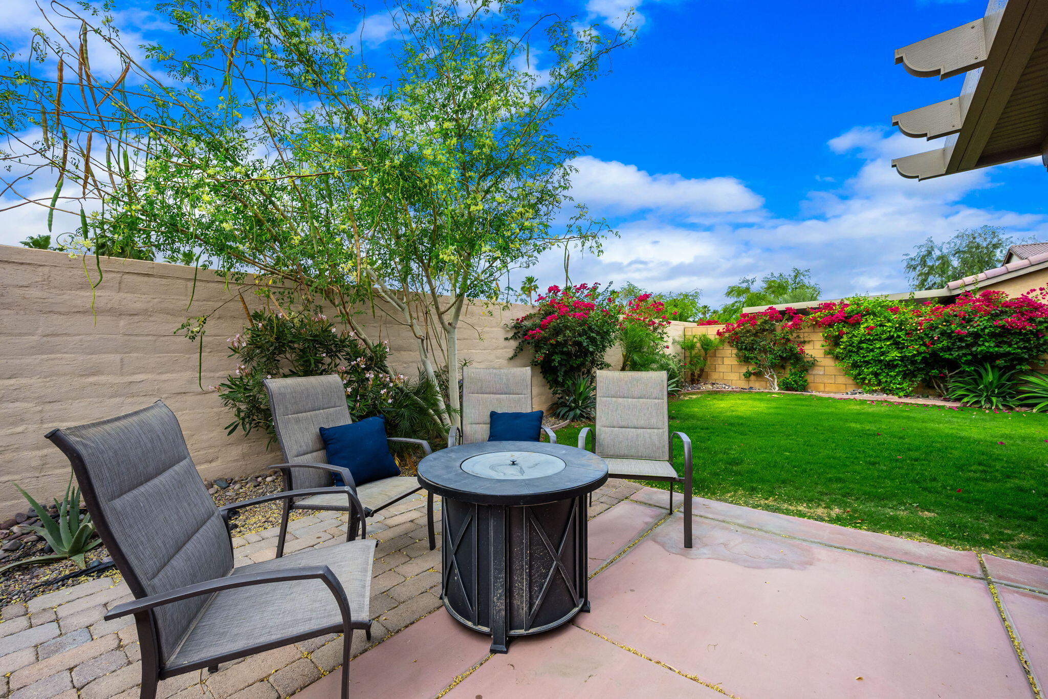 84131 Azzura Way Indio, CA 92203 - Photo 26 of 38 a view of a chairs and table in the garden