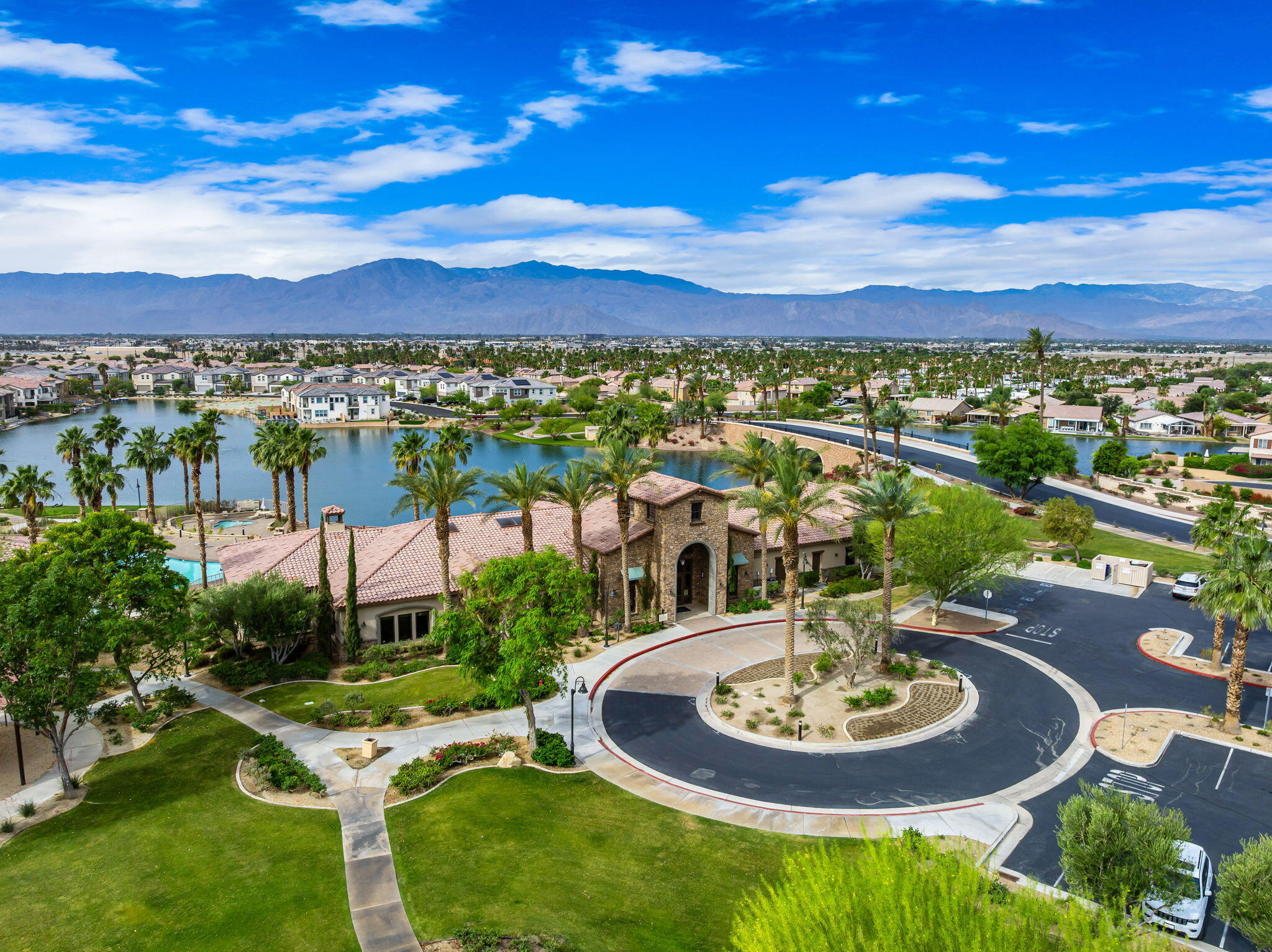 84131 Azzura Way Indio, CA 92203 - Photo 32 of 38 a view of a swimming pool with a table and chairs