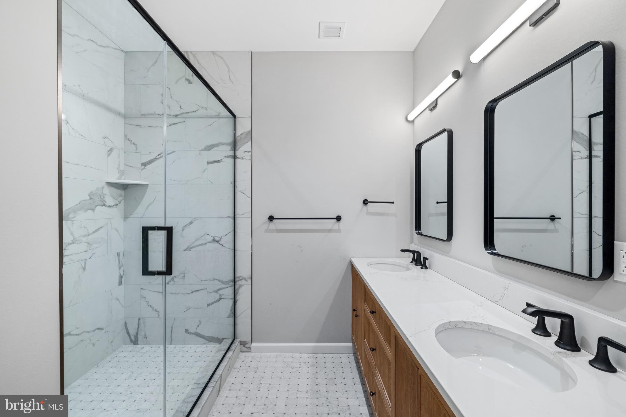 200 South Broad Street, Unit 206 Philadelphia, PA 19102 - Photo 28 of 55 a bathroom with a sink and mirror